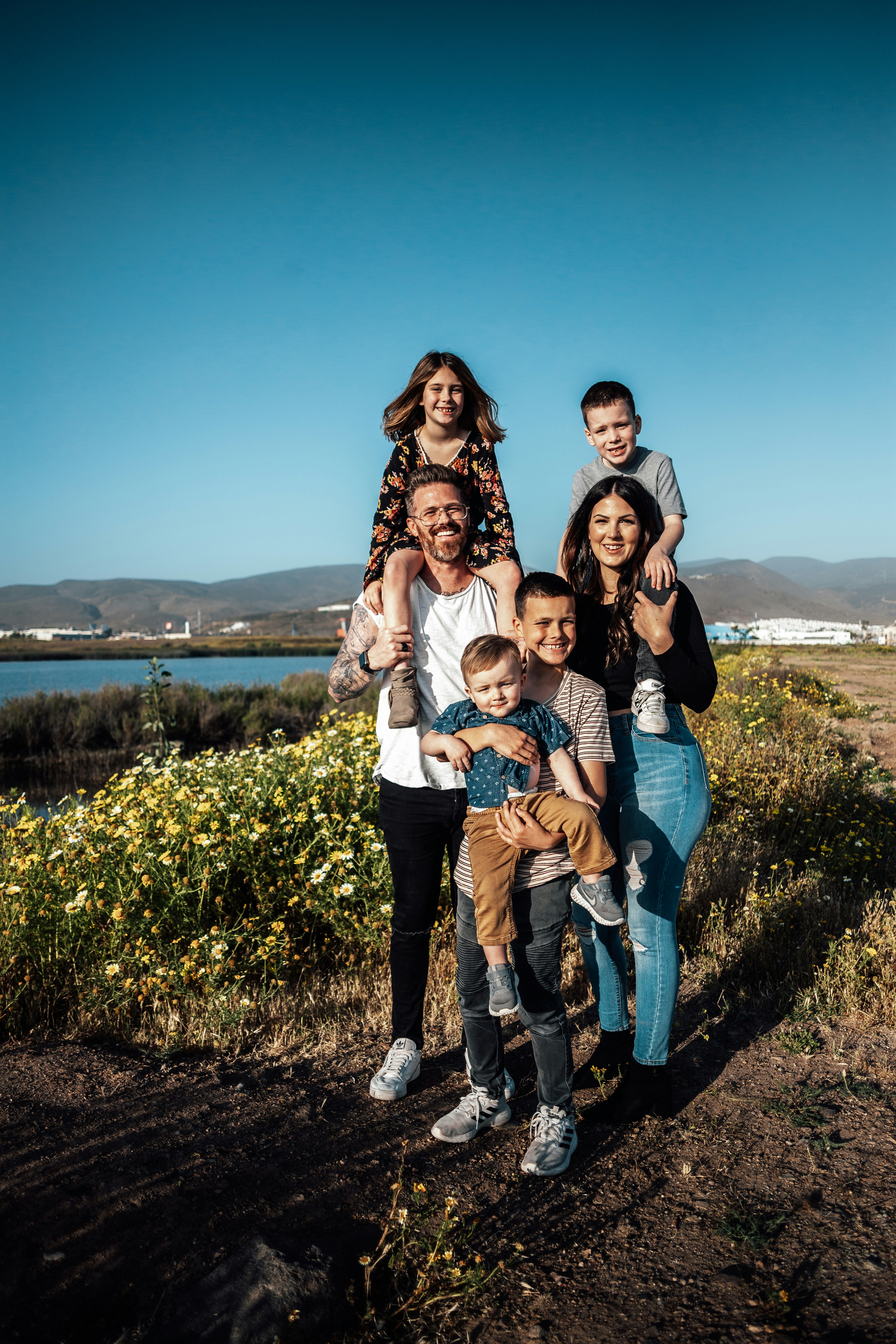 Large happy family with children smiling outdoors